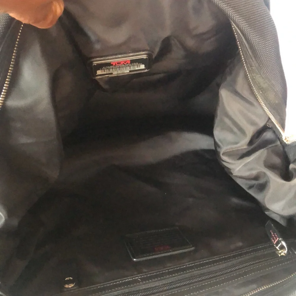 TUMI black Boston 2 way leather and canvas and mini lock. Detachable straps.